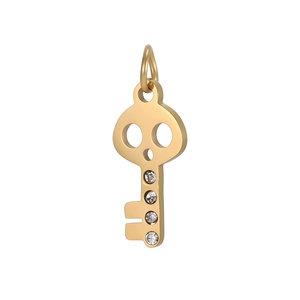 Detailed view of a gold skull key pendant with four inset clear zircon crystals