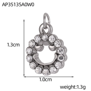 Silver smiley face pendant with clear cubic zirconia stones and 1.3cm size detail