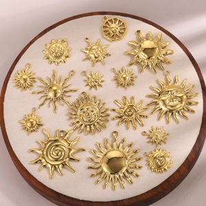 Golden sun smiley pendant collection with diverse 3D embossed designs for DIY jewelry craft