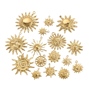 15-piece set of gold sun and star charms with diverse engraved facial designs and textures