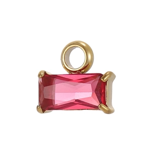 Detail of a rectangular red crystal pendant with a gold setting and bail for jewelry making