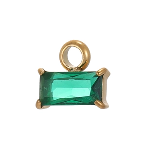 Detail of emerald green zircon pendant with gold plated rectangular facet stone setting