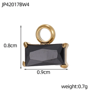 Macro detail of rectangular black faceted gemstone pendant with gold alloy loop and size info