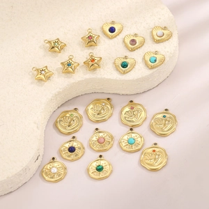 Assorted gold stainless steel pendants with star, heart, and footprint designs