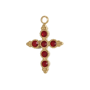 Macro shot of gold stainless steel cross pendant with red gemstones and beaded edging