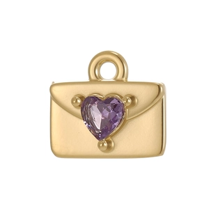 Detailed view of heart-shaped purple zirconia set in a gold plated envelope pendant