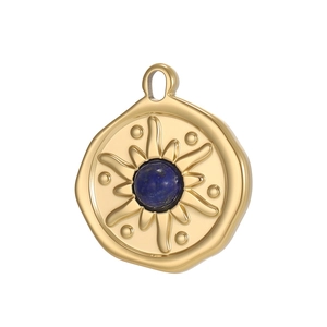 Detailed macro view of a golden sunburst pendant featuring a central deep blue gemstone
