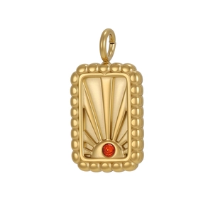 Détail du pendentif vintage soleil avec pierre orange et bordure perlée dorée