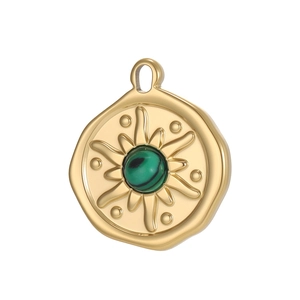 Detail of gold circular pendant featuring sunburst texture and green malachite bead inlay