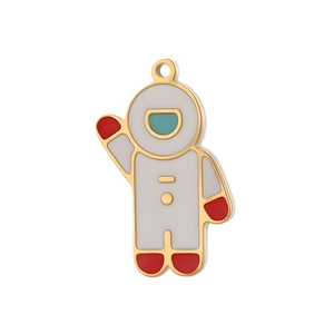 Detail of an astronaut enamel pendant in white and gold for DIY jewelry making