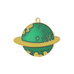 Detailed view of green and gold Saturn charm pendant with space enamel drip craft