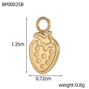 Detailed macro view of golden strawberry pendant charm with circular hook for jewelry DIY