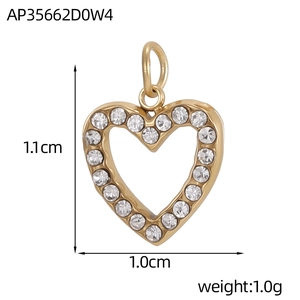 Detail of cubic zirconia heart pendant in gold finish measuring 1.1cm by 1.0cm