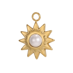 Detail of sunflower pendant with golden finish and white pearl inlay for jewelry making