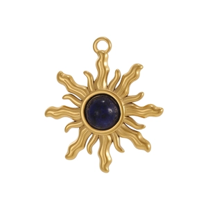 Macro view of gold sunflower pendant with deep blue natural stone inlay for jewelry DIY