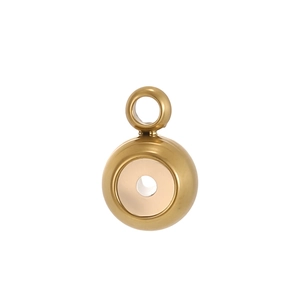 Detailed macro view of a polished golden round pendant connector for jewelry making