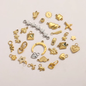 Variety set of gold DIY jewelry pendants featuring heart, butterfly, and star shapes