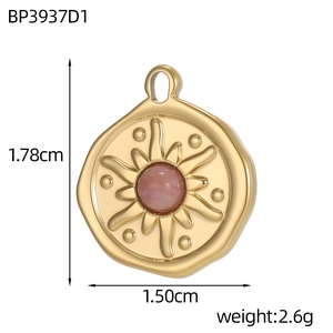 Detailed view of a gold-plated stainless steel round pendant with a pink stone inlay
