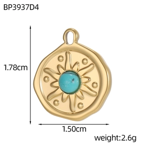 Detailed view of gold sun pendant with turquoise stone and dimension measurements