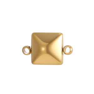 Detailed view of a gold pyramid jewelry charm with two side loops on white background