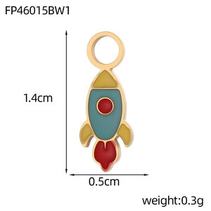 Detailed macro view of rocket shaped enamel pendant with gold trim and top hanging ring