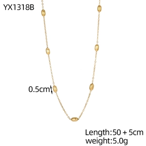 Elegant gold choker necklace with oval metallic beads on a minimalist adjustable chain