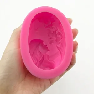 Pink oval silicone mold featuring a 3D embossed girl profile with flower patterns
