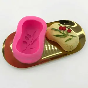 Olive branch leaf silicone mold for DIY soap and chocolate baking on a gold tray