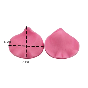 Detail view of pink petal-shaped silicone fondant molds with size labels 6.0CM and 7.0CM