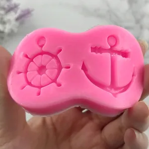 Pink silicone mold featuring detailed anchor and ship wheel designs for DIY fondant crafts