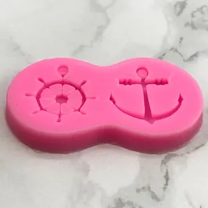 Pink silicone mold featuring nautical anchor and ship wheel for DIY cake or jewelry