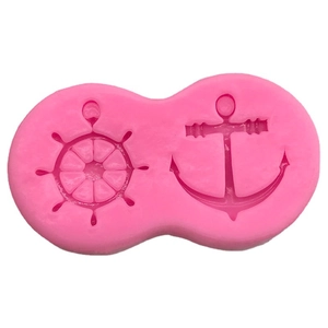 Pink silicone mold featuring nautical ship wheel and anchor shapes for fondant cake decorating