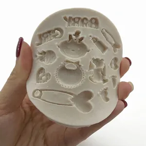 White silicone mold with baby themed motifs for fondant cake decorations and DIY chocolate