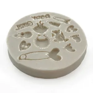 Silicone mold with baby bottle, rattle, and footprint patterns for fondant and DIY crafts