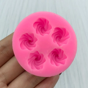Pink silicone mold with 5 spiral floral cavities for DIY fondant and chocolate baking