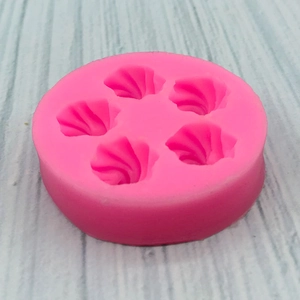 Pink silicone mold with five shell-shaped cavities for cake fondant and chocolate making