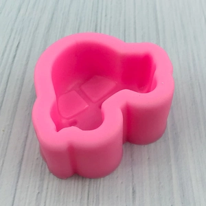 Pink silicone car-shaped baking mold for DIY cakes and chocolates shown at a 45-degree angle