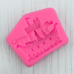 Vue macro du moule en silicone rose Arche de Noé pour fondant, savon et résine