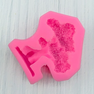 Macro shot of pink silicone tree mold for fondant cake decorating and DIY epoxy resin crafts