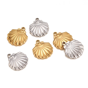 Detailed view of fan-shaped stainless steel shell pendants in gold and silver plating