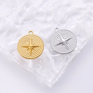 Macro detail of gold and silver stainless steel star pendants on textured crystal base