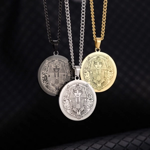 Detailed view of ancient Egyptian pharaoh pendants in gold, silver, and black finish