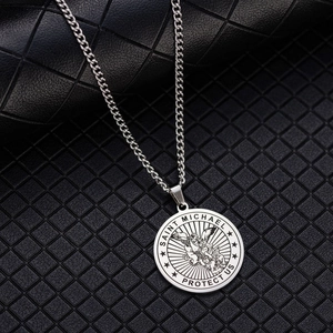 Detail of Saint Michael Archangel engraving on a round stainless steel pendant necklace