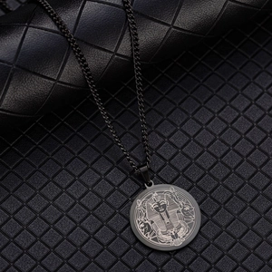 Macro detail of laser-engraved Egyptian Pharaoh pendant in matte black finish