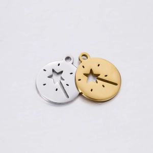 Detail of silver and gold stainless steel hollow star magic wand round pendants