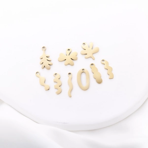 Set of 9 gold stainless steel leaf and wavy pendants for DIY jewelry making