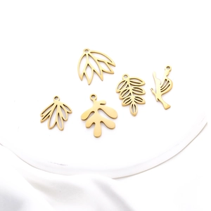 Detailed set of five gold hollow leaf and bird charms for DIY stainless steel jewelry
