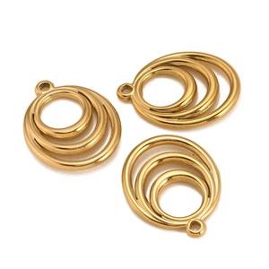 Close-up of three nested gold geometric circle charms for DIY jewelry making