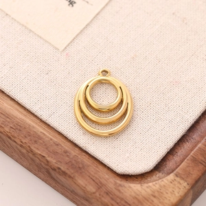 Macro shot of gold stainless steel triple circle pendant for DIY jewelry making