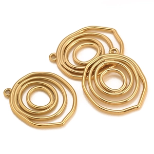 Macro shot of gold-plated concentric geometric rings for DIY jewelry charms